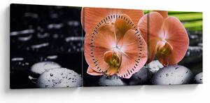 Obraz - Oranžová orchidea s palmovými listami (s hodinami) (90x30 cm)