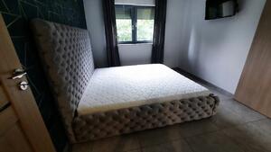 Moderná čalúnená posteľ FIGO EXTRA - Drevený rám, 140x200
