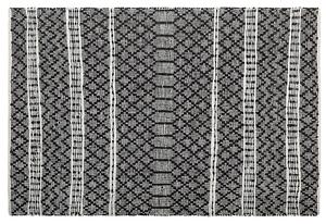 Koberec čierny a béžový pravá koža 140 x 200 cm nízky vlas geometrický vzor ručne obdĺžnikový