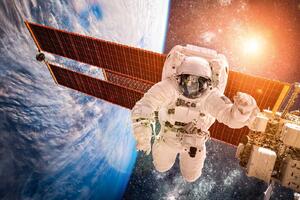 DIMEX | Vliesové fototapety na stenu Astronaut nad Zemou MS-5-2265 | 375 x 250 cm | modrá, biela, krémová, hnedá
