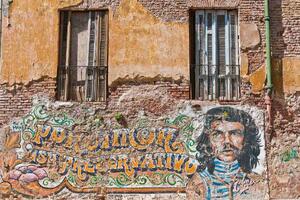 DIMEX | Vliesové fototapety na stenu Che Guevara graffiti MS-5-0796 | 375 x 250 cm | žltá, oranžová, hnedá