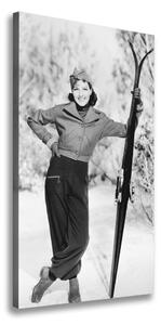 Vertikálny foto obraz na plátne Žena s lyžami