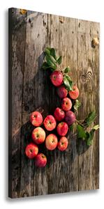 Vertikálny foto obraz na plátne Jablká na stole