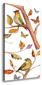 Vertikálny foto obraz na plátne Vtáky motýle lístia