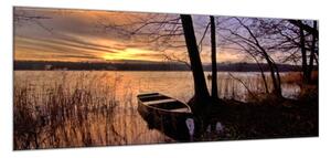 Obraz sklenený jazero s loďkou v západe slnka - 50 x 100 cm