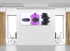 Obraz sklenený kvet fialová orchidea na hladine vody s kameňmi - 50 x 100 cm