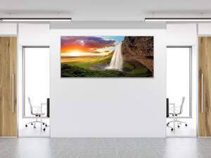 Obraz sklenený vodopád v horách a západ slnka - 50 x 100 cm
