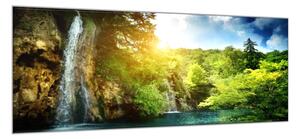 Obraz sklenený vodopád v lese a východ slnka - 50 x 100 cm