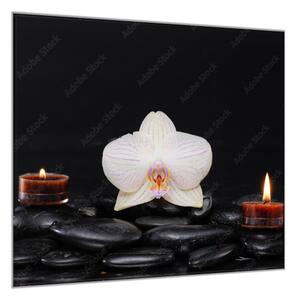 Obraz sklenený štvorcový kvet biela orchidea na kameňoch a sviečky - 34 x 34 cm