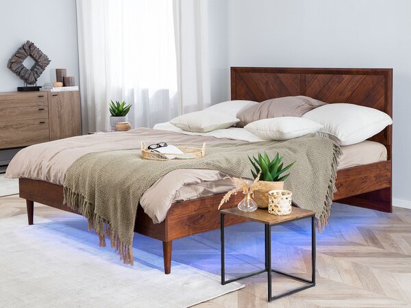 Posteľ tmavé drevo 180 x 200 cm viacfarebné LED osvetlenie s vysokým čelom rustikálny moderný štýl spálňa