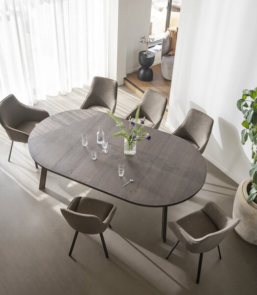 Tmavohnedý okrúhly rozkladací jedálenský stôl v dekore duba ø 130 cm Glenside – Rowico