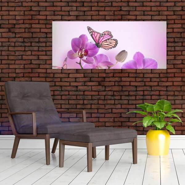 Obraz - Motýľ na kvetoch orchidey, lila (120x50 cm)
