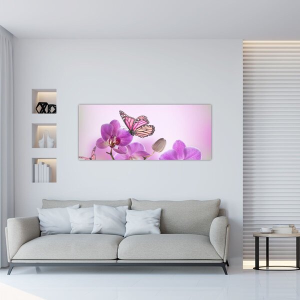 Obraz - Motýľ na kvetoch orchidey, lila (120x50 cm)