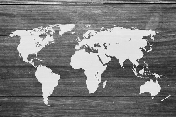 Obraz na korku čiernobiela mapa sveta s dreveným pozadím
