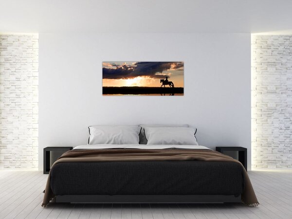 Obraz - Jazdec na koni pri západe slnka (120x50 cm)