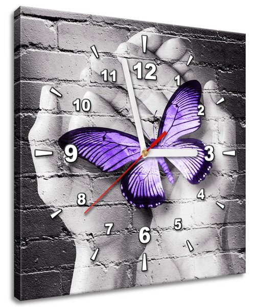 Obraz s hodinami Fialový motýľ na dlaniach Rozmery: 30 x 30 cm