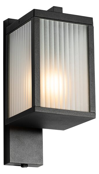 Vonkajšia nástenná lampa čierna s rebrovaným sklom a senzorom súmraku - Charlois