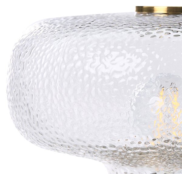 Stolná lampa mosadzná kovová základňa priehľadné tienidlo z textúrovaného skla moderný glamour štýl obývacia izba