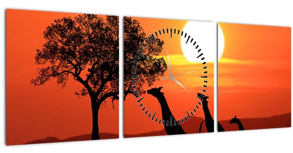 Obraz žirafy pri západe slnka (s hodinami) (90x30 cm)