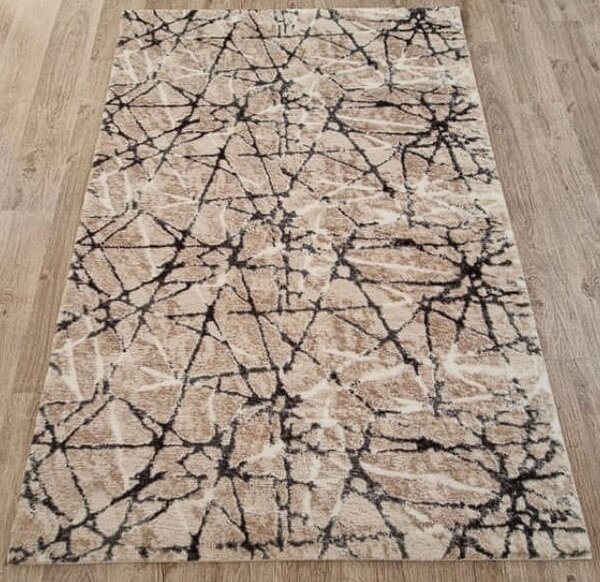 Béžový huňatý koberec Plush Deluxe – mramorový vzor Rozmer: 50x80 cm