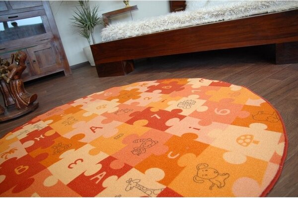 Dywany Lusczow Detský guľatý koberec PUZZLE oranžový