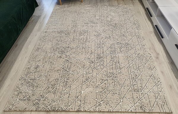 Moderný koberec Artiste 23241-CREAM v béžovej farbe Rozmer: 60x110 cm