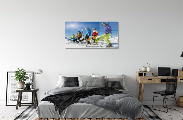 Obraz na skle Lyžiari zimné hory 100x50 cm 2 Prívesky