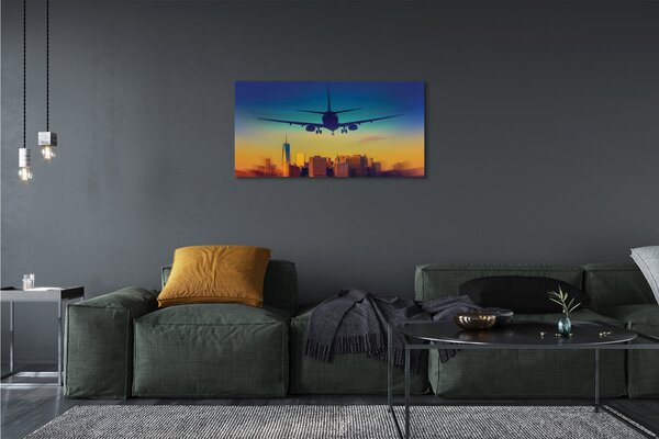 Obraz canvas Veľkomesto oblačnosti lietadlo západ 100x50 cm