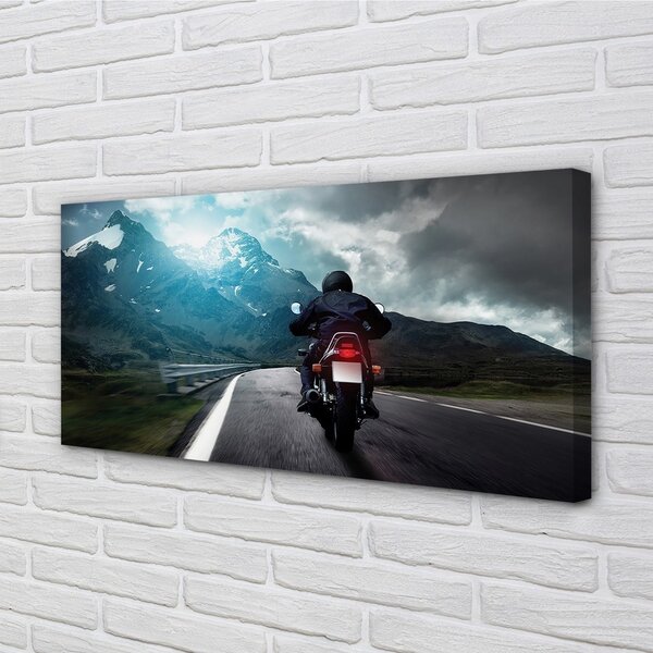 Obraz canvas Motocykla horskej ceste muž neba 100x50 cm