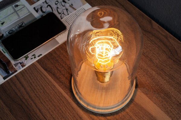 Estila Dizajnová retro stolná lampa Edison s hnedou drevenou podstavou a priehľadným skleneným tienidlom 22 cm