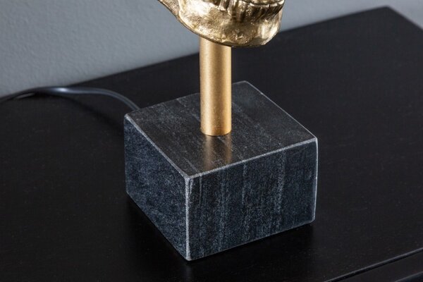 Estila Art deco stolná lampa Uma v zlatom prevedení s kovovou lebkou s čiernym okrúhlym tienidlom 56cm