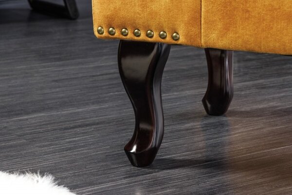 Estila Dizajnová taburetka Cella s Chesterfield zamatovým čalúnením s drevenými nožičkami horčicovo žltá 80cm