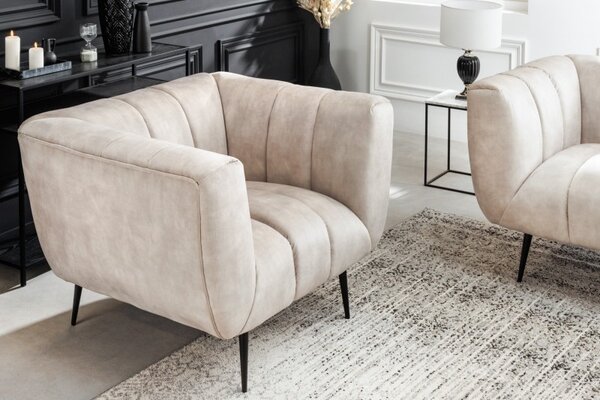 Estila Art deco moderné kreslo Vermont v krémovom champagne čalúnení na čiernych nožičkách 106cm