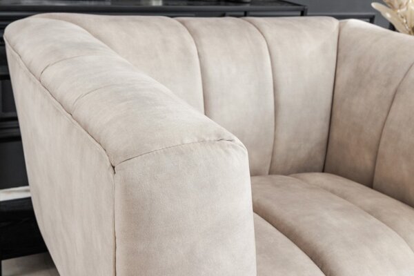 Estila Art deco moderné kreslo Vermont v krémovom champagne čalúnení na čiernych nožičkách 106cm