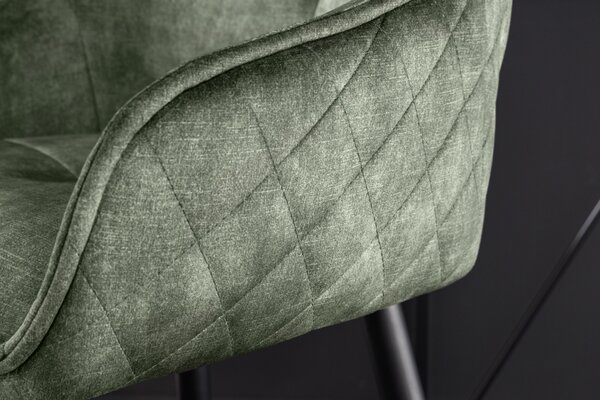 Estila Moderná industriálna barová stolička Rufus s olivovozeleným zamatovým čalúnením a čiernou konštrukciou z kovu 100cm