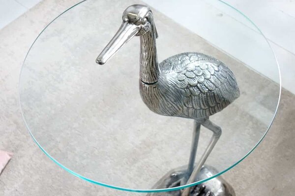 Estila Dizajnový okrúhly príručný stolík Ardea so skulpturálnou podstavou v tvare volavky v striebornej farbe 88 cm