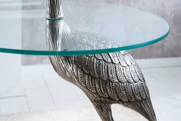 Estila Dizajnový okrúhly príručný stolík Ardea so skulpturálnou podstavou v tvare volavky v striebornej farbe 88 cm