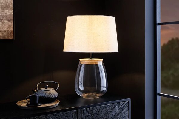 Estila Štýlová sklenená stolná lampa Clasico s nohou v podobe priesvitnej nádoby s valcovým béžovým tienidlom 60 cm