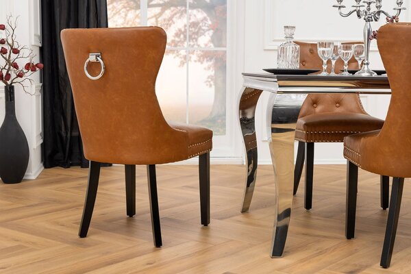 Estila Chesterfield jedálenská stolička Torino s čalúnením z hnedej kože s prešívaným operadlom s čiernymi drevenými nožičkami 93 cm