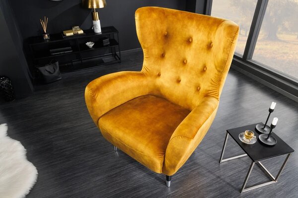 Estila Art deco kreslo Bolte s horčicovým žltým zamatovým poťahom a vysokou chrbtovou opierkou s dizajnom ušiaka 106 cm