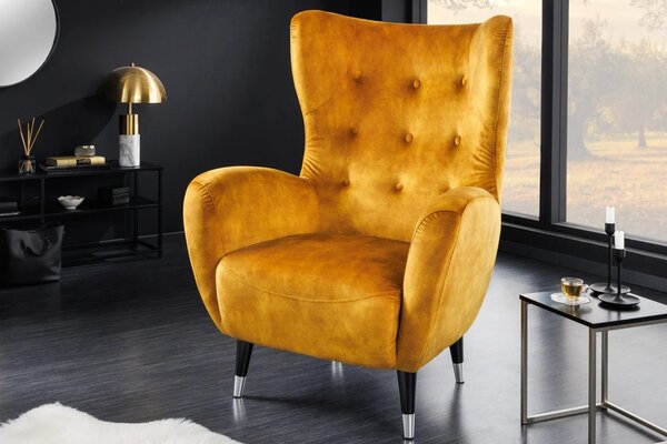 Estila Art deco kreslo Bolte s horčicovým žltým zamatovým poťahom a vysokou chrbtovou opierkou s dizajnom ušiaka 106 cm