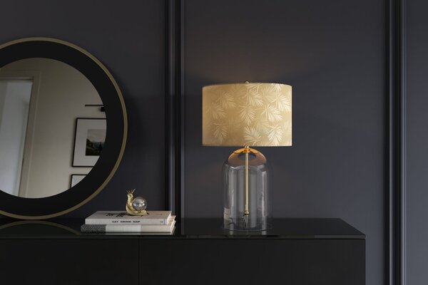 Estila Dizajnová glamour nočná lampa Gambier so zlatým tienidlom so vzorom palmových listov a priehľadnou sklenenou nohou 47 cm