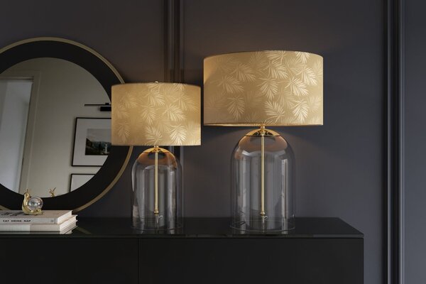 Estila Dizajnová glamour nočná lampa Gambier so zlatým tienidlom so vzorom palmových listov a priehľadnou sklenenou nohou 47 cm