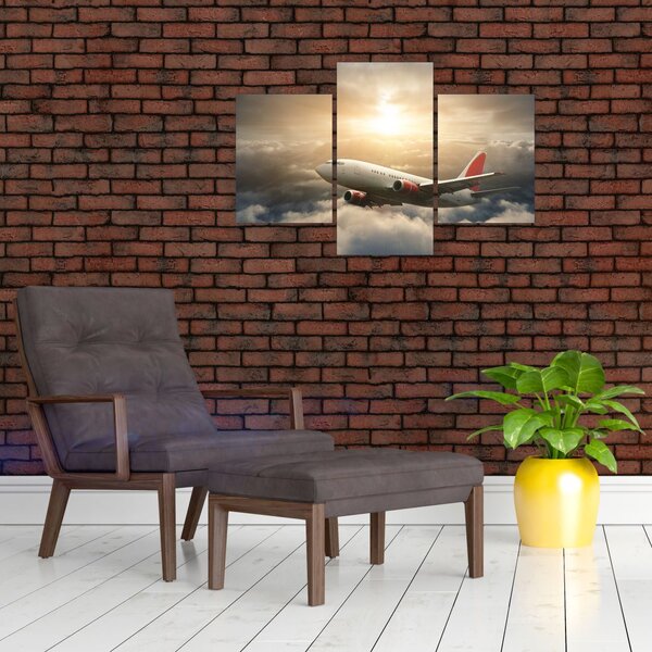 Obraz - Lietadlo v oblakoch (90x60 cm)