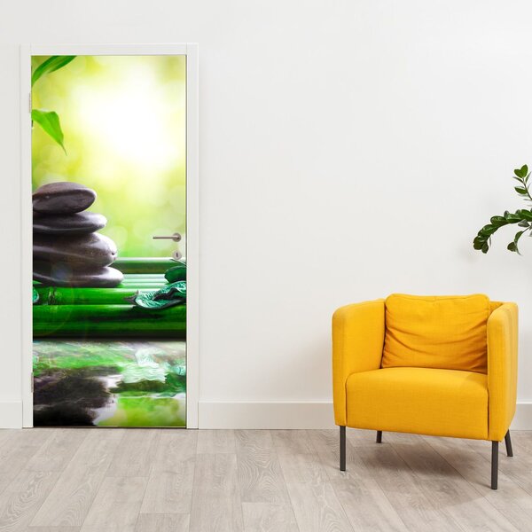 Fototapeta na dvere - Masážne kamene a orchidea na vode (95x205cm)