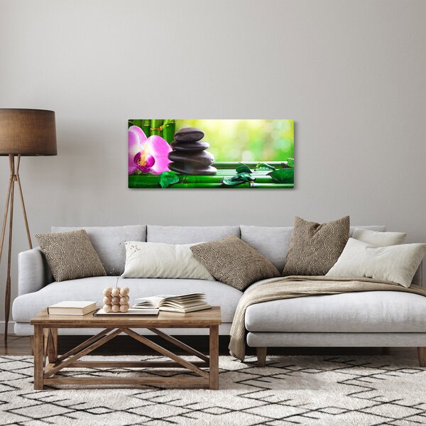 Obraz masážnych kameňov a orchidey na vode (120x50 cm)