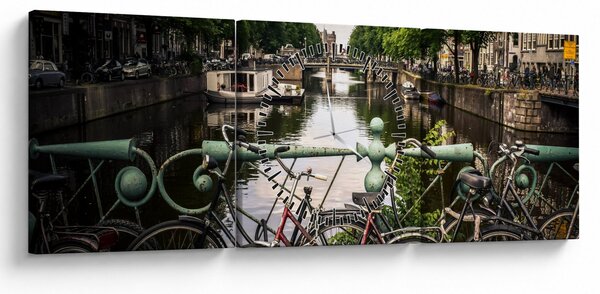 Obraz bicykla v meste (s hodinami) (90x30 cm)
