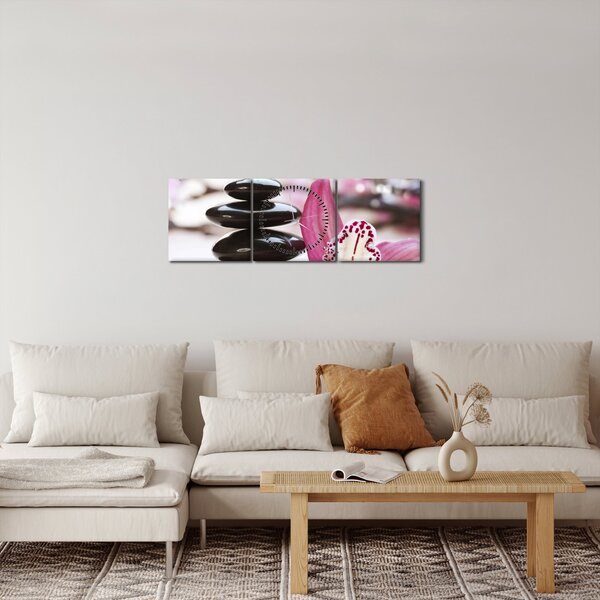 Obraz masážnych kameňov a orchidey na vode (s hodinami) (90x30 cm)