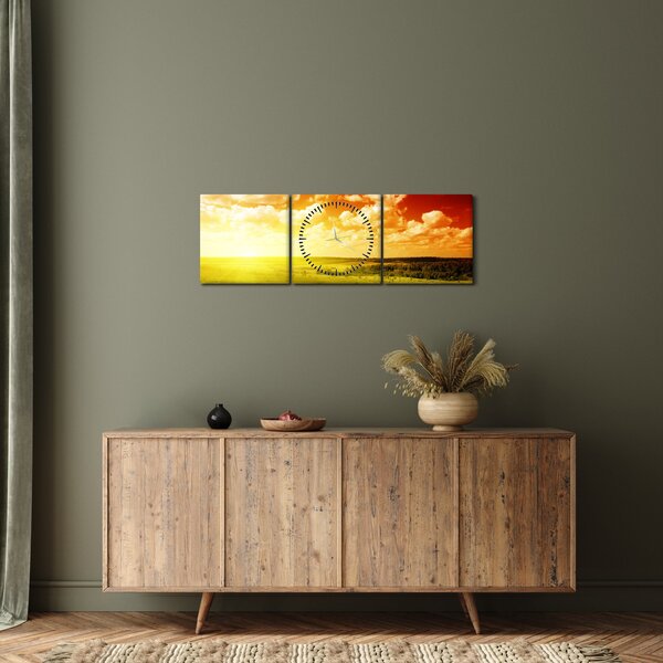 Obraz lúky so žiariacim slnkom (s hodinami) (90x30 cm)