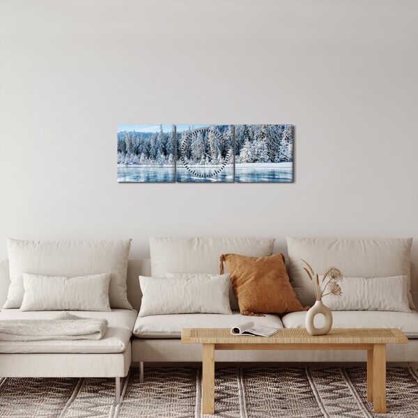 Obraz zamrznutého jazera a zasnežených stromov (s hodinami) (90x30 cm)